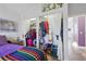 Bedroom boasts a walk-in closet, hardwood floors and bright natural light from the oversized windows at 1686 S Logan St, Denver, CO 80210
