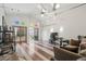 Spacious bonus room with modern lighting, gaming desk, and sliding door access to a private patio at 1686 S Logan St, Denver, CO 80210