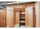 Rustic closet offers shelf space, with natural wood doors and trim at 1686 S Logan St, Denver, CO 80210