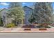 Charming two-story home features mature trees and a welcoming entrance at 1686 S Logan St, Denver, CO 80210
