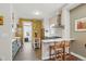 Lovely eat-in kitchen with stainless steel appliances and a breakfast bar at 1686 S Logan St, Denver, CO 80210
