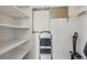 Well-organized pantry with white shelving, metal storage racks, and a convenient rolling ladder at 1686 S Logan St, Denver, CO 80210