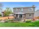 Landscaped backyard features a covered gazebo with outdoor seating, perfect for entertaining at 11076 Cotton Creek Dr, Westminster, CO 80031