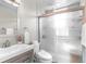 Modern bathroom with a sleek vanity, glass-enclosed shower, and contemporary fixtures at 11076 Cotton Creek Dr, Westminster, CO 80031