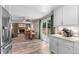 Open floorplan kitchen featuring stainless appliances and seamless flow into dining area at 11076 Cotton Creek Dr, Westminster, CO 80031