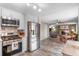 Open kitchen featuring stainless steel appliances and seamless flow into living area at 11076 Cotton Creek Dr, Westminster, CO 80031