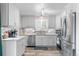Modern kitchen features granite countertops, stainless steel appliances, and tile backsplash at 11076 Cotton Creek Dr, Westminster, CO 80031