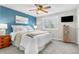 Bright and airy main bedroom featuring a soothing accent wall, plush carpet, and ample natural light at 11076 Cotton Creek Dr, Westminster, CO 80031