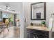 Stylish powder room with granite countertop, elegant fixtures, and convenient location near the living area at 11076 Cotton Creek Dr, Westminster, CO 80031