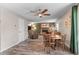 Living room with a brick fireplace, ceiling fan, and classic decor at 11076 Cotton Creek Dr, Westminster, CO 80031