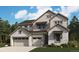 Charming two-story home featuring stone accents and a three-car garage, offering both style and functionality at 2650 Bitterroot Pl, Highlands Ranch, CO 80129