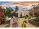 Beautiful backyard with a lush garden, outdoor seating and a detached two car garage at 2990 Osceola St, Denver, CO 80212