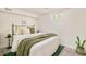 Cozy basement bedroom featuring a comfortable bed and natural light at 2990 Osceola St, Denver, CO 80212