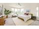 Bright bedroom with plush carpet, neutral decor, and large windows offering scenic views at 2990 Osceola St, Denver, CO 80212