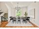 Bright dining room with large windows, modern lighting, and beautiful hardwood floors at 2990 Osceola St, Denver, CO 80212