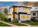 Modern two-story home featuring sleek architectural lines, a beautiful front yard, and abundant natural light at 2990 Osceola St, Denver, CO 80212
