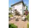 Charming two-story home featuring a well-manicured front yard with patio furniture at 2990 Osceola St, Denver, CO 80212