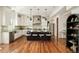 Modern kitchen with stainless steel appliances, central island with seating, and custom cabinetry at 2990 Osceola St, Denver, CO 80212