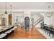 Open-concept area showcasing hardwood floors, a modern kitchen, and an adjacent dining space at 2990 Osceola St, Denver, CO 80212