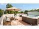 Relax on the rooftop deck, complete with hot tub, lounge furniture, and lush greenery at 2990 Osceola St, Denver, CO 80212