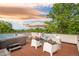 Relax on the rooftop deck, complete with hot tub, lounge furniture, fire pit, and mountain views at 2990 Osceola St, Denver, CO 80212