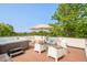 Relax on the rooftop deck, complete with hot tub, lounge furniture, fire pit, and mountain views at 2990 Osceola St, Denver, CO 80212
