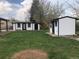 Spacious backyard with two sheds painted white and black, perfect for storage or a workshop at 10751 W 66Th Ave, Arvada, CO 80004