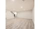 Spacious basement area with light-colored flooring, ready for customization and various uses at 10751 W 66Th Ave, Arvada, CO 80004