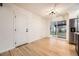 Dining area with sliding doors and hardwood floors at 10751 W 66Th Ave, Arvada, CO 80004