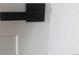 Close-up of modern, black door hardware set against a white door and light-colored wall at 10751 W 66Th Ave, Arvada, CO 80004