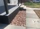 Inviting front porch with gray painted trim, stone accents, and new concrete steps, creating a welcoming entrance at 10751 W 66Th Ave, Arvada, CO 80004