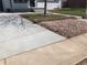 Attractive front yard featuring decorative rock landscaping, a well-maintained lawn, and a concrete path at 10751 W 66Th Ave, Arvada, CO 80004