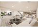 Inviting living room showcasing stylish decor, open shelving, and comfortable seating arrangement at 10751 W 66Th Ave, Arvada, CO 80004