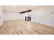Spacious living room boasts newly refinished hardwood floors and fresh neutral paint at 10751 W 66Th Ave, Arvada, CO 80004