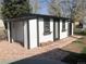 An exterior view of the shed featuring a private patio area at 10751 W 66Th Ave, Arvada, CO 80004