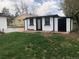 Exterior view of the black and white shed showing the ample yard space at 10751 W 66Th Ave, Arvada, CO 80004