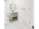 Bathroom features a neutral vanity, toilet, and stone floors, combining style and functionality at 3957 S Peach Way, Denver, CO 80237