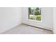 Sun-filled bedroom with plush carpet and large window at 3957 S Peach Way, Denver, CO 80237