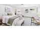 Cozy bedroom with carpet, natural light, a comfortable bed, and a view of the outdoors at 3957 S Peach Way, Denver, CO 80237