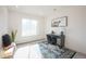 Cozy bedroom features bright natural light, carpeted floor, and office furniture at 3957 S Peach Way, Denver, CO 80237
