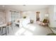 Large bedroom featuring a cozy bed, stylish decor, and an open bathroom, creating a relaxing retreat at 3957 S Peach Way, Denver, CO 80237