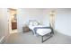 Well-lit bedroom featuring a full bed, a sliding closet, and access to an attached bathroom at 3957 S Peach Way, Denver, CO 80237