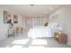 Bright, spacious bedroom boasts a cozy bed, large windows, and stylish decor for a relaxing retreat at 3957 S Peach Way, Denver, CO 80237