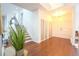 Bright foyer with hardwood floors and easy access to the main living area at 3957 S Peach Way, Denver, CO 80237