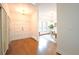 Inviting foyer featuring hardwood floors and views into the living area at 3957 S Peach Way, Denver, CO 80237