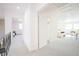 Hallway features the white walls and open doorframes that lead to other parts of the house at 3957 S Peach Way, Denver, CO 80237