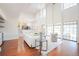 Open-concept living room featuring hardwood floors and wrought iron details at 3957 S Peach Way, Denver, CO 80237