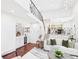 Bright living room featuring hardwood floors, bar area and modern decor at 3957 S Peach Way, Denver, CO 80237