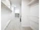 Spacious walk-in closet offers ample storage with built-in shelving and is equipped with a washer and dryer at 3957 S Peach Way, Denver, CO 80237