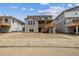 Backyard view showcasing the home's exterior and an inviting deck space at 24748 E 40Th Ave, Aurora, CO 80019
